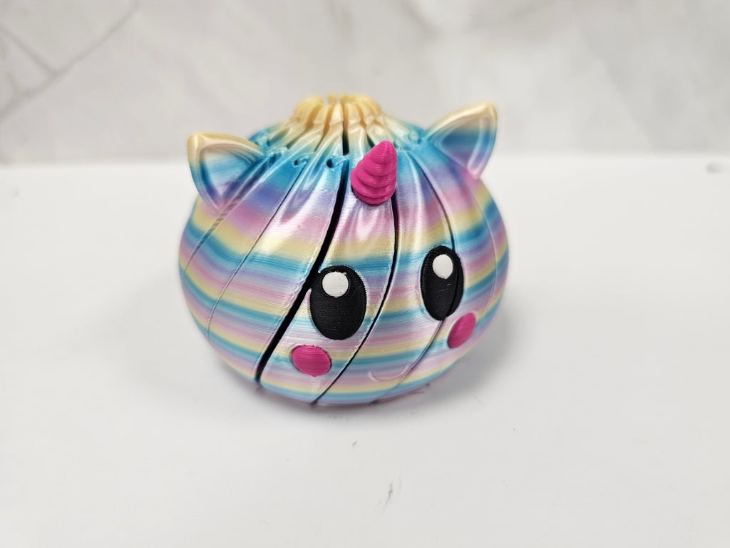 Made In Cobham 3D-printed rainbow unicorn fidget sphere with a segmented design for tactile sensory play.